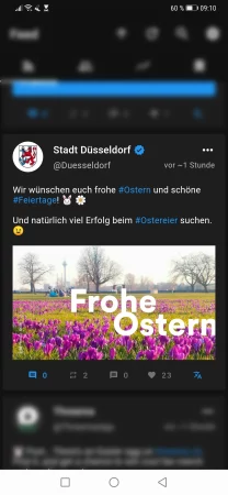 Screenshot vom Tweet der Stadt Düsseldorf in Twitter mit einer künstlerischen Fotografie vom Rheinpark Düsseldorf mit den Worten "Frohe Ostern" im Jahr 2022